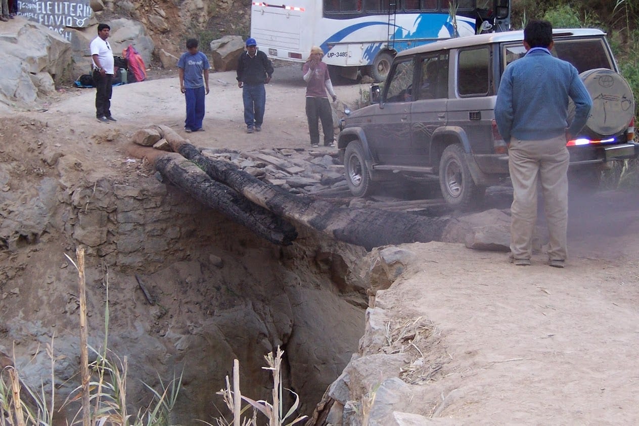 4WD crossing dodgy bridge in Peru