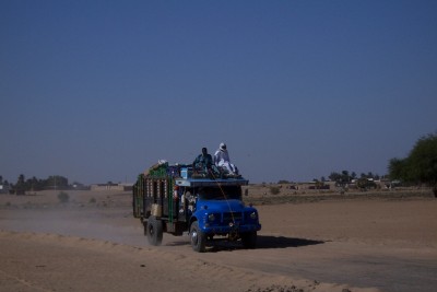 A truck moving through the desert in Sudan