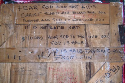 Graffiti on an accommodation door when cycling in Africa