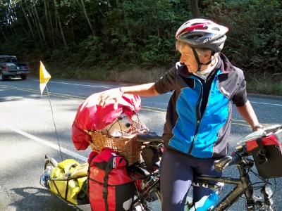 Regina cycling wit her dog along the Pacific Coast Highway