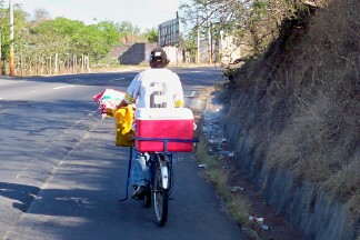 Racing a local when cycling in El Salvador