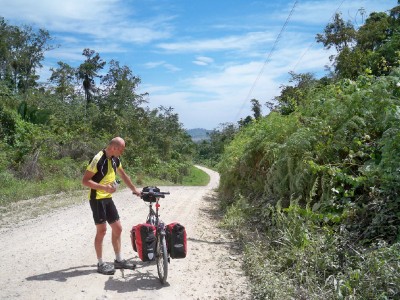 Oliver taking a break when cycling from Bethel to Flores