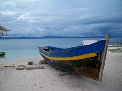 Colourful fihsing boat and amazing waters of the San Blas islands near Panama