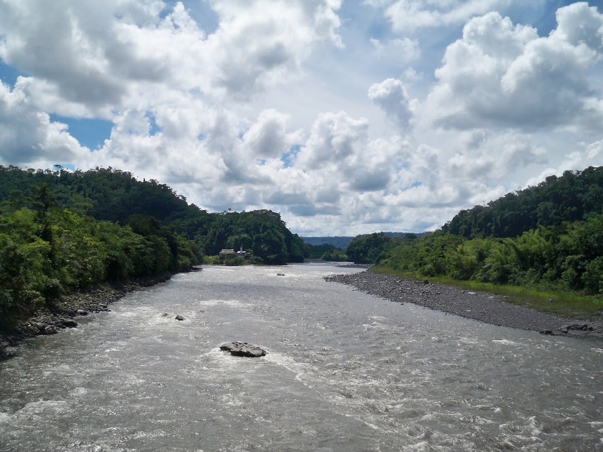 Cycling across a river in Ecuador