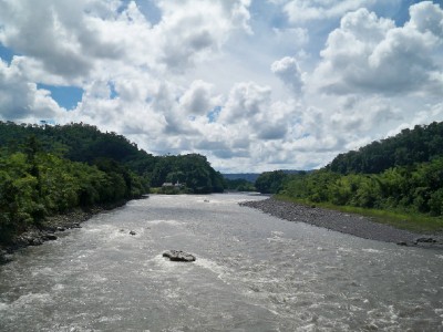 Crossing a river in Ecuador when cycling