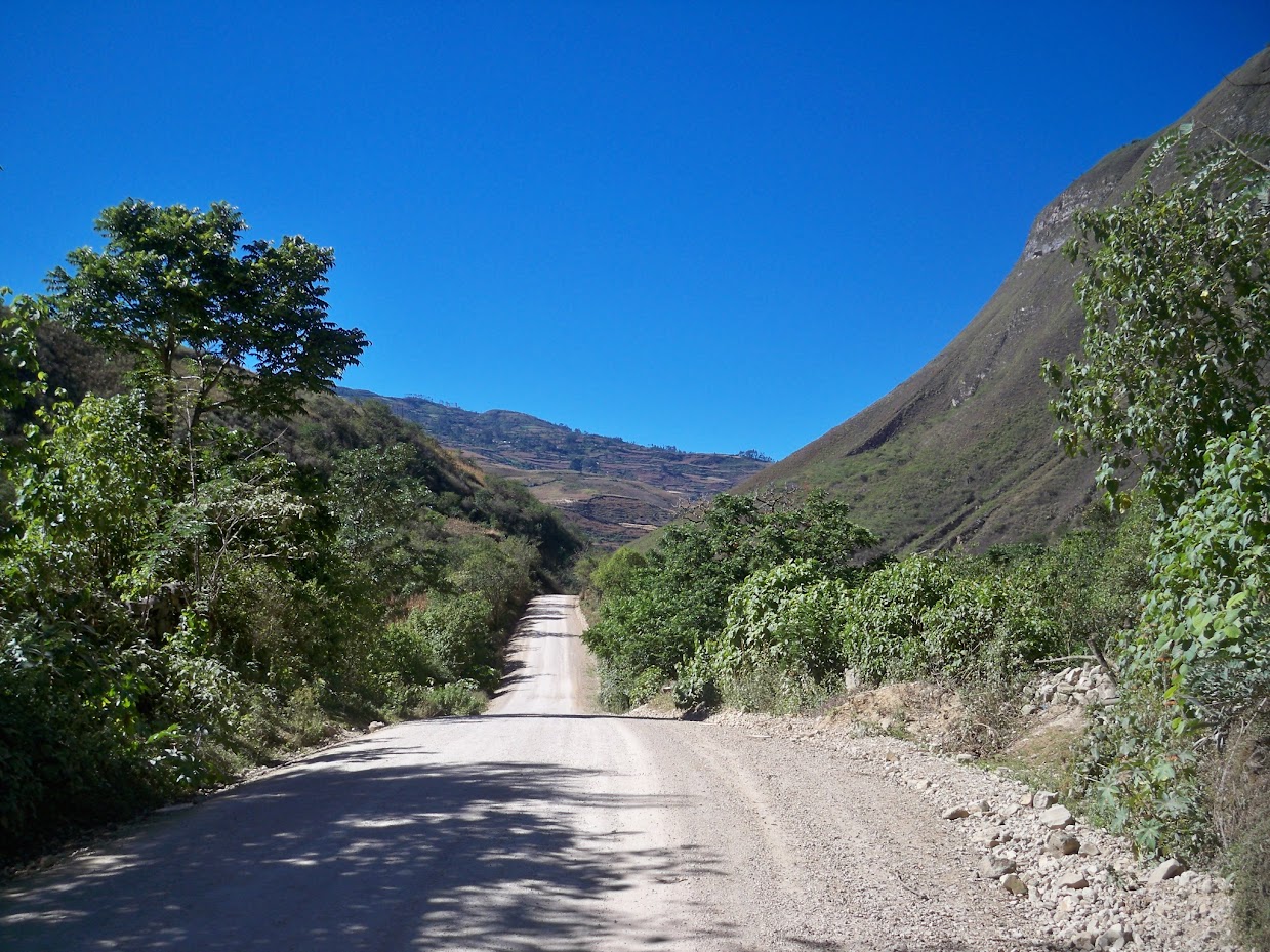 Cycling along the dirt road towards Leymebamba in Peru