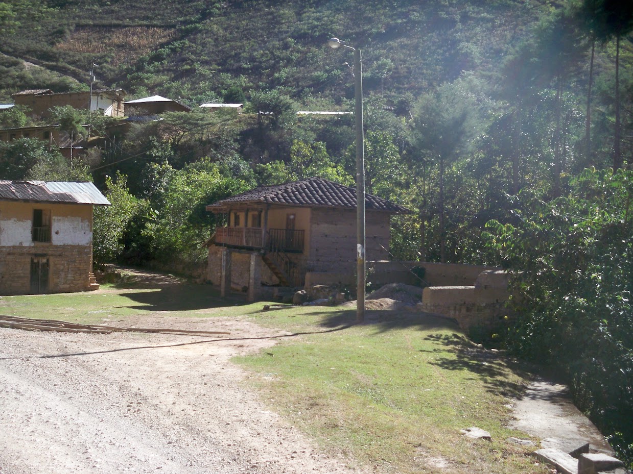 Cycling past a village in Peru