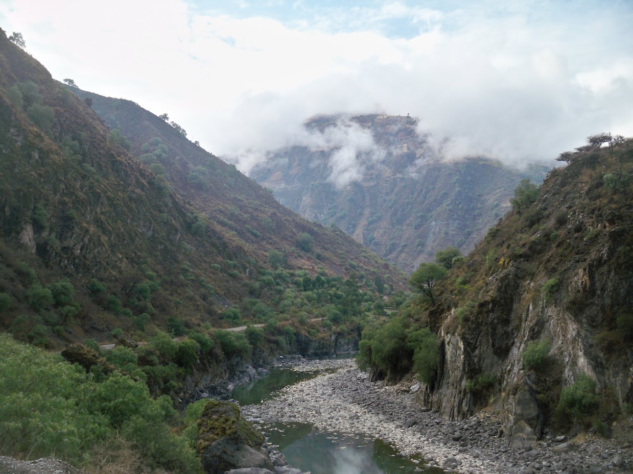 Cycling out of a village in Peru, and into the clouds!