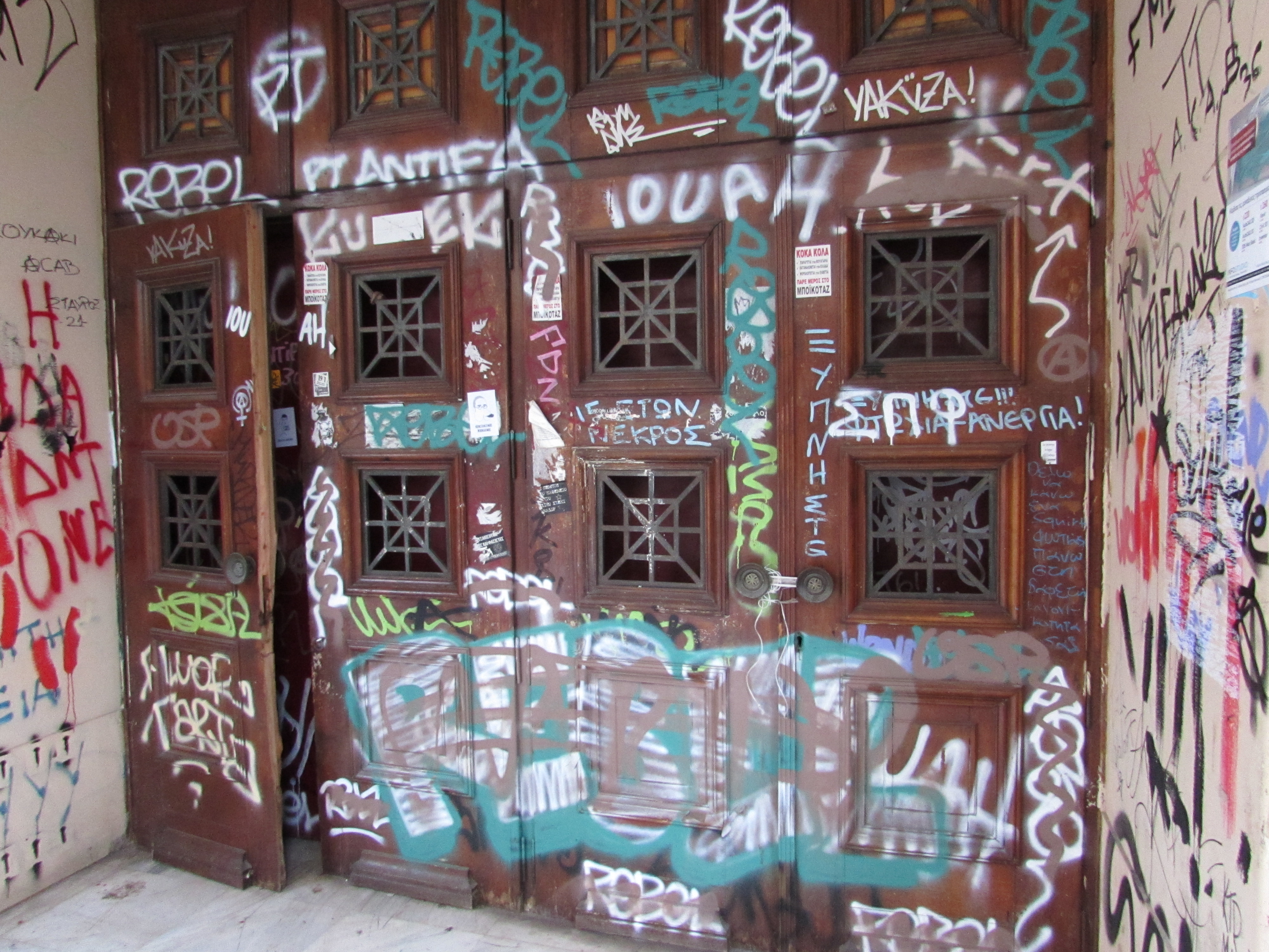 Graffiti on a door at Athens Polytechnic