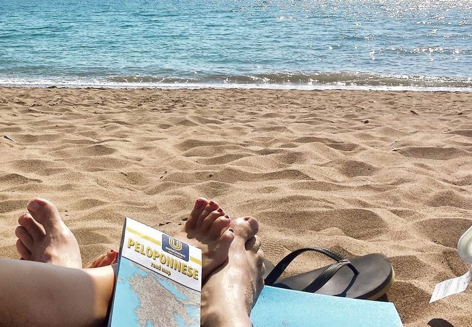 South Peloponnese Road Trip Greece - Planning the next place to go, whilst listening to the waves on the beach.