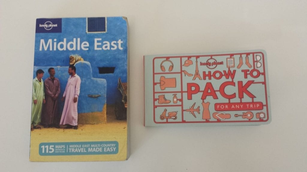 Comparing How To Pack For Any Trip with a standard size Lonely Planet Book