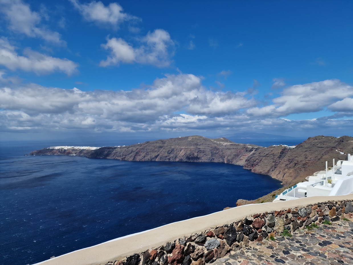 Oia in the distance as seen when walking from Fira to Oia in Santorini