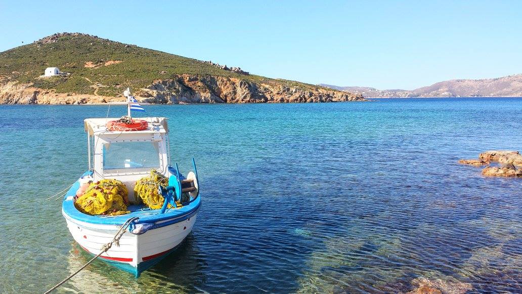 A boat floating in a quiet bay in Patmos