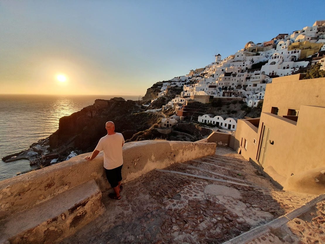 Dave from Dave's Travel Pages enjoying a July sunset in Santorini
