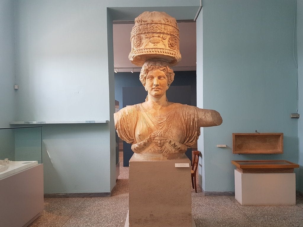 Female statue at Elefsina carrying something on her head