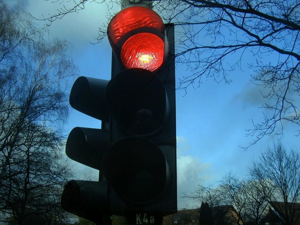 If you want to cycle safe on a bike tour, then remember to stop at red traffic lights!
