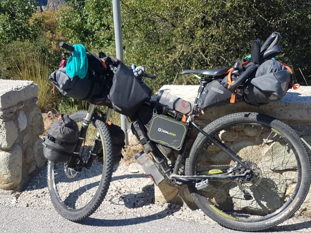 A bikepacking setup with front handlebar roll bag