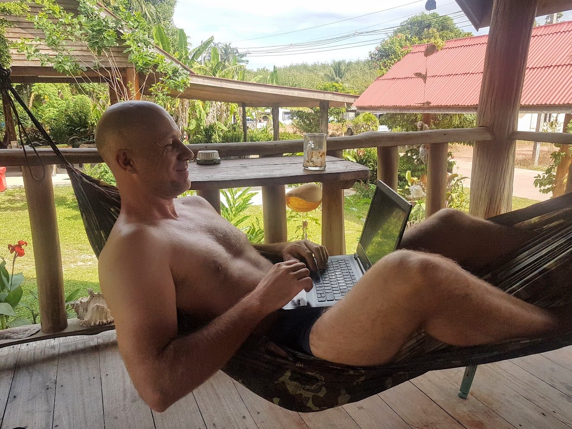 Dave Briggs working in a hammock