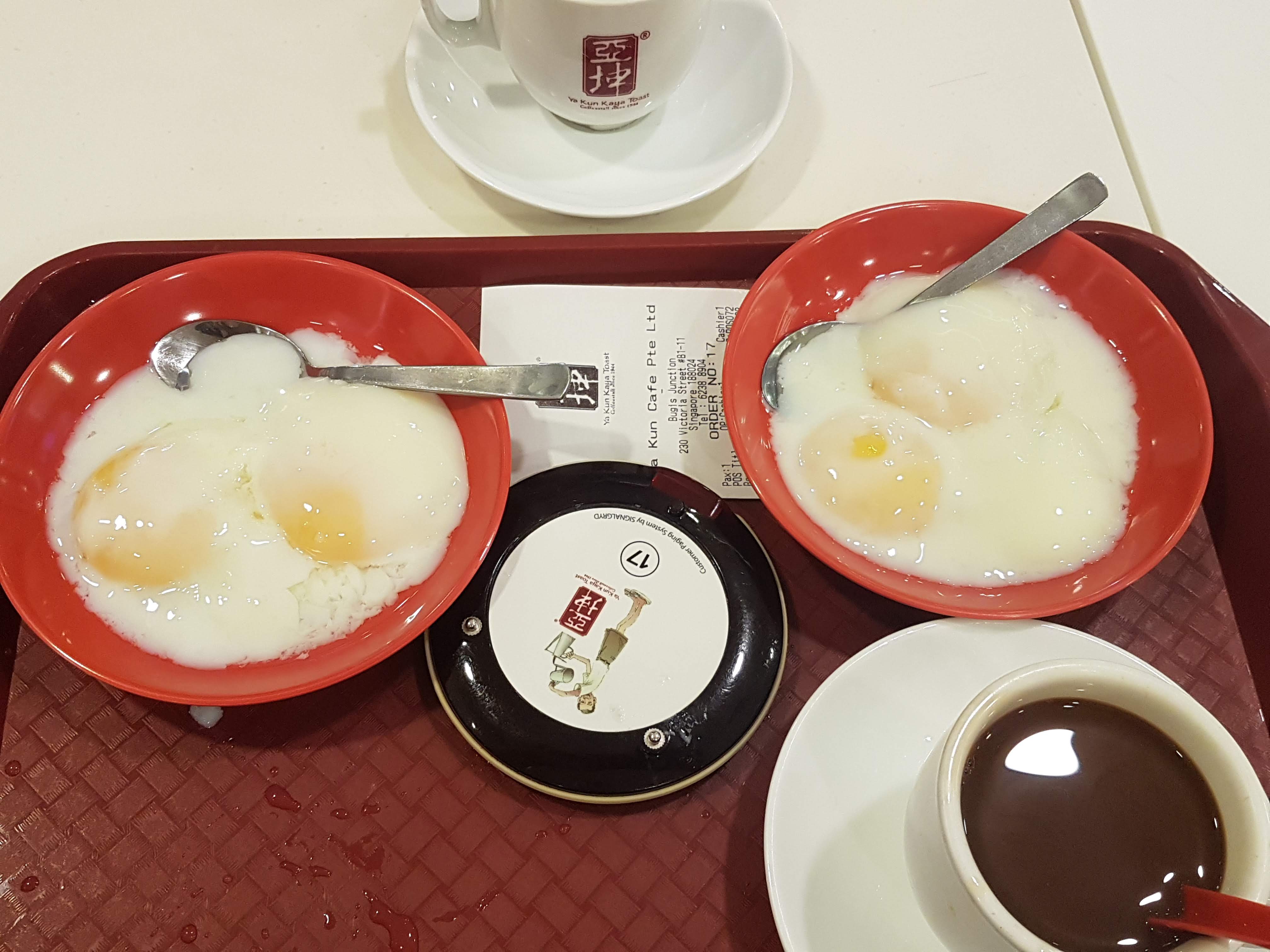 A traditional breakfast of runny eggs in Singapore