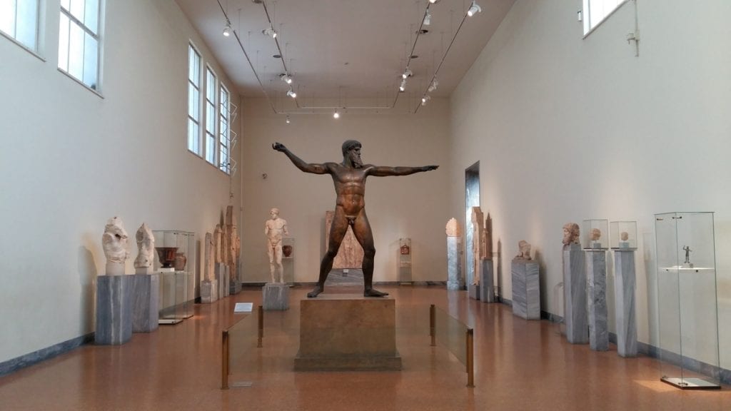 Make sure to visit the National Archaeological Museum in Athens in winter to see magnificent statues such as this bronze of either the God Zeus or Poseidon.