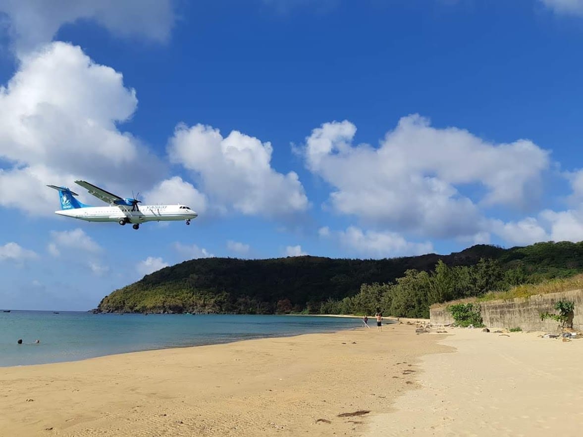 Plane landing over the beach at Con Dao island in Vietnam