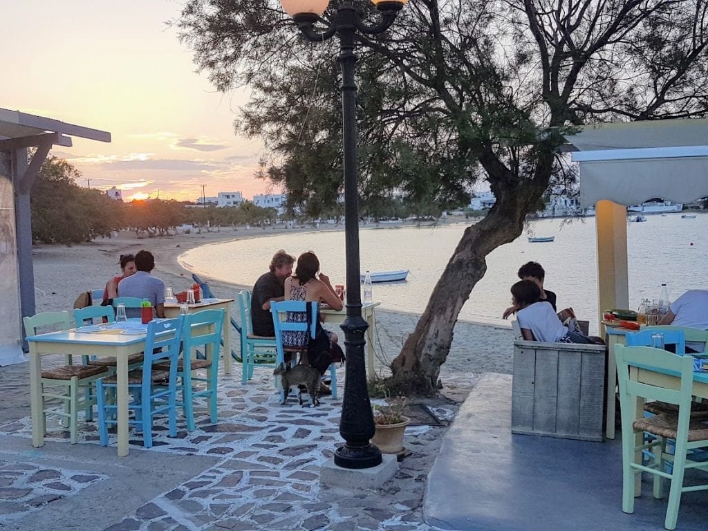 A sunset meal by the sea in Pollonia Milos Greece