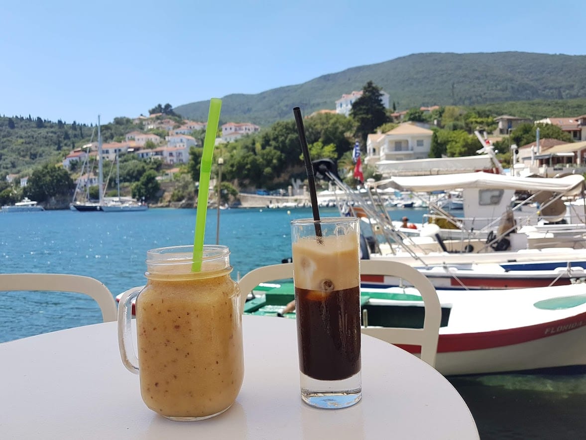 Relaxing with some cool drinks by a bay in Ithaka Greece