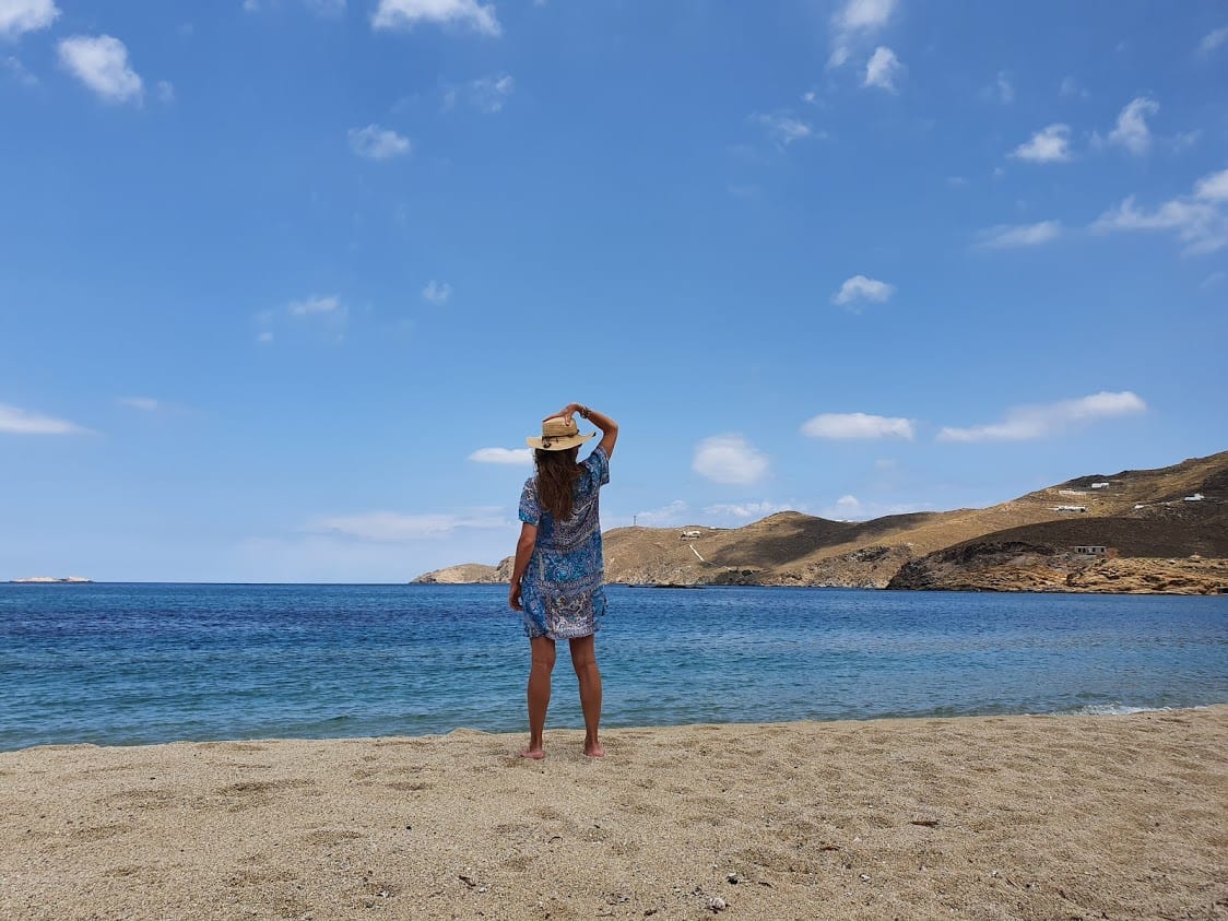 Standing on a windy beach in Mykonos