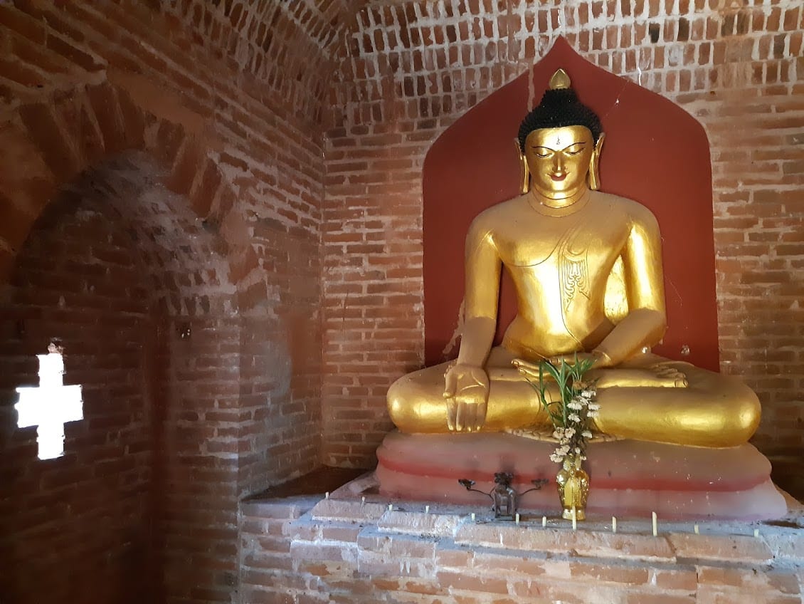 A Buddha and the cross symbol in a pagoda in Bagan