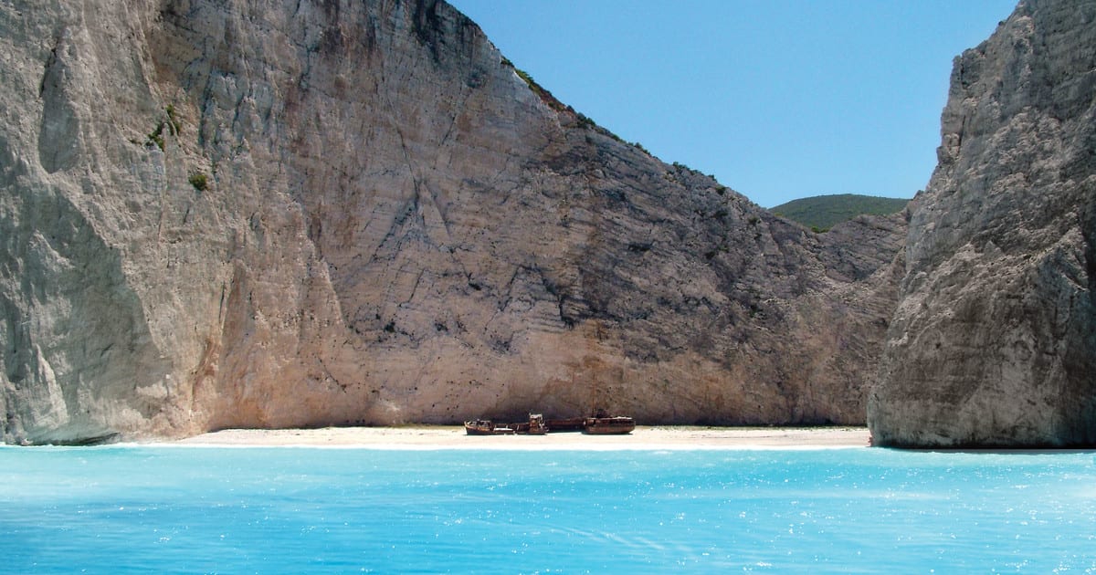 Early morning tour of the famous Shipwreck beach and Blue Caves in glass-bottom speedboat