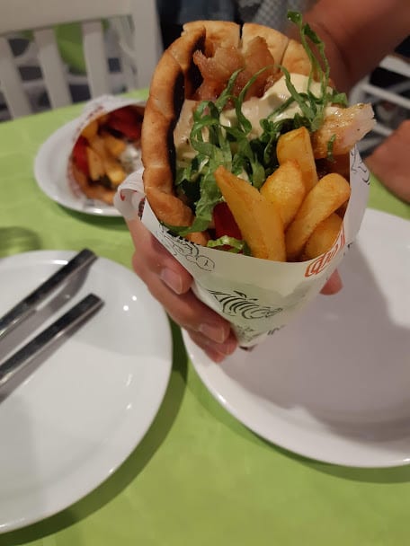 Eating a pork gyros in Greece