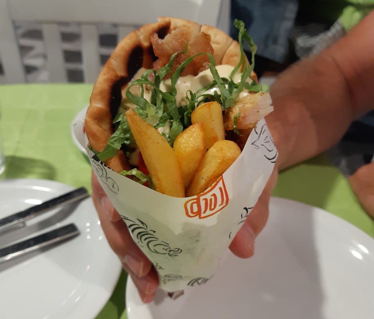 Eating a filling souvlaki and gyros in Greece