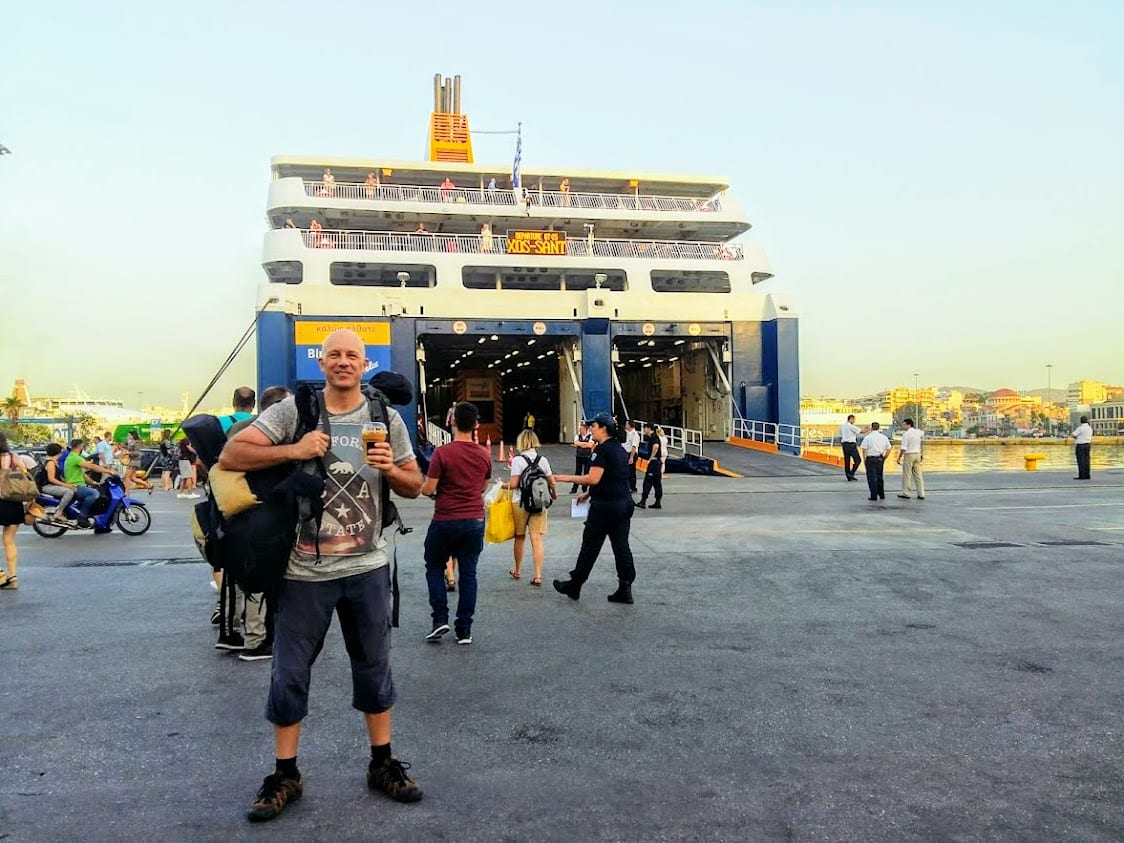 Dave Briggs in front of a ferry in Greece