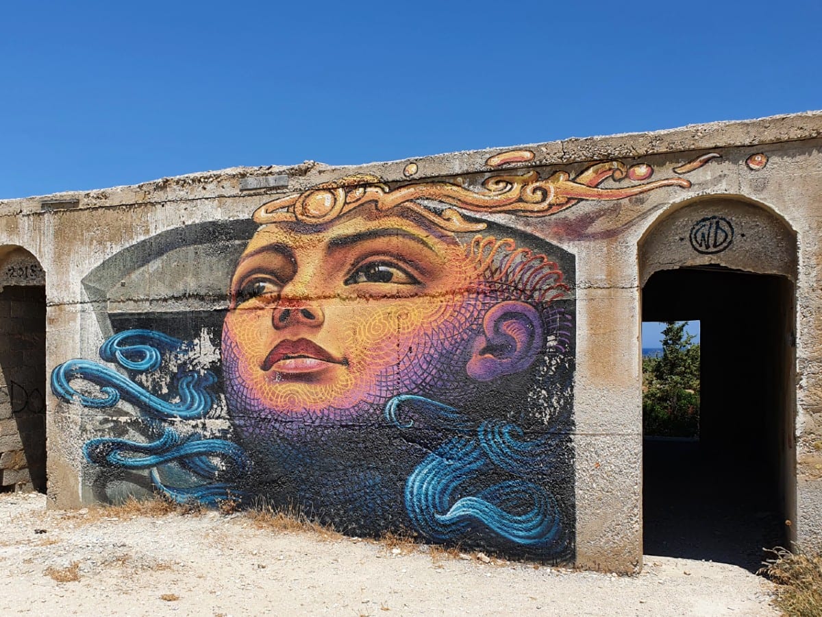 Street art at an abandoned hotel in Alyko, Naxos
