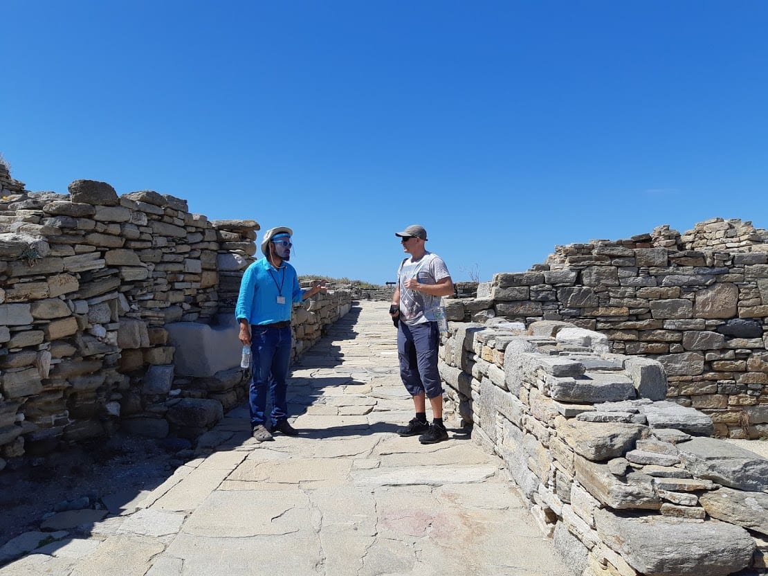 Dave from Dave's Travel Pages and a tour guide in Delos island in Greece