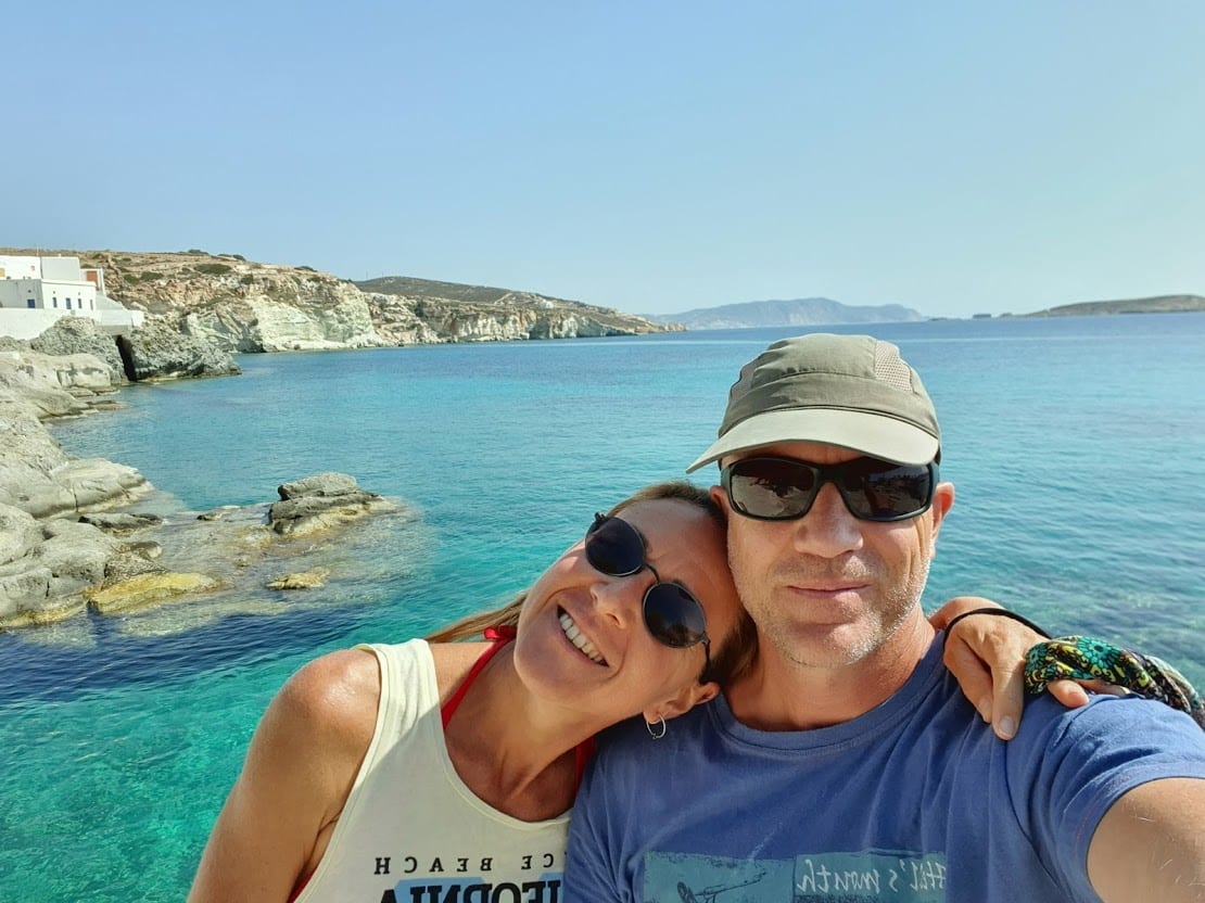 Dave and Vanessa by the clear sea at Goupa in Kimolos island Greece