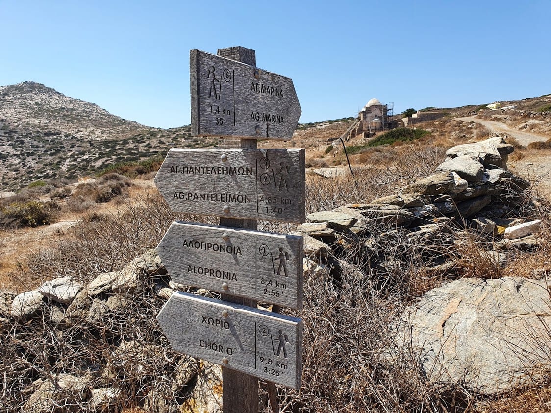 A signpost marking hiking trails in sikinos
