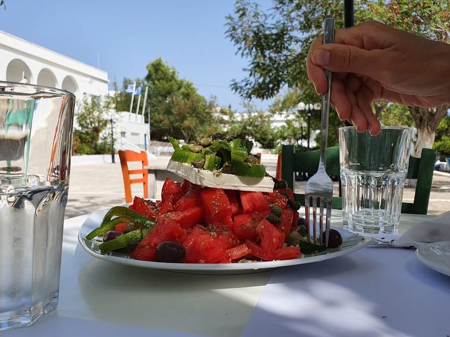 Eating a large Greek salad in Fatse taverna in Milos greece