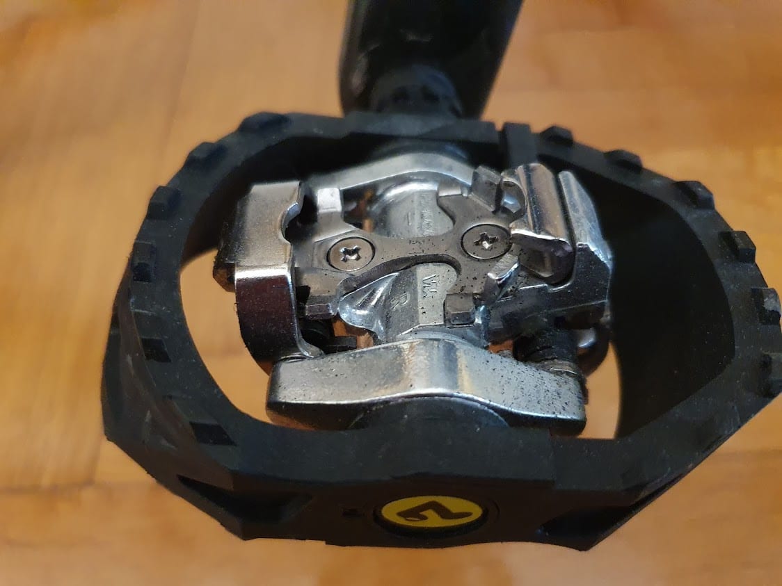 I use these Shimano SPD pedals for bicycle touring