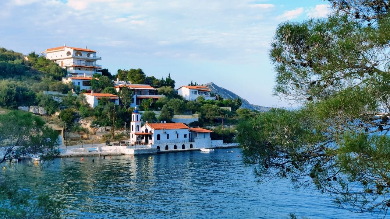 A view of a church over the water in Salamina island Greece