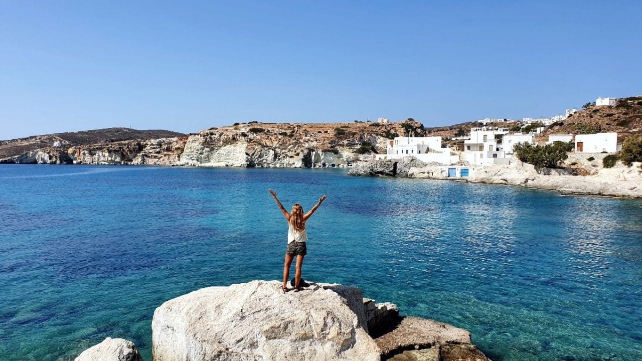 Standing on the rocks in front of Goupa village in Kimolos island