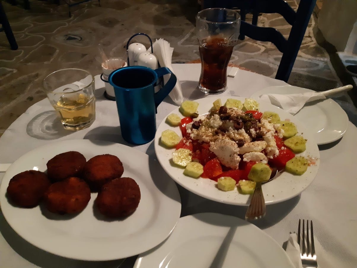 Delicious Greek food at a restaurant in Kimolos
