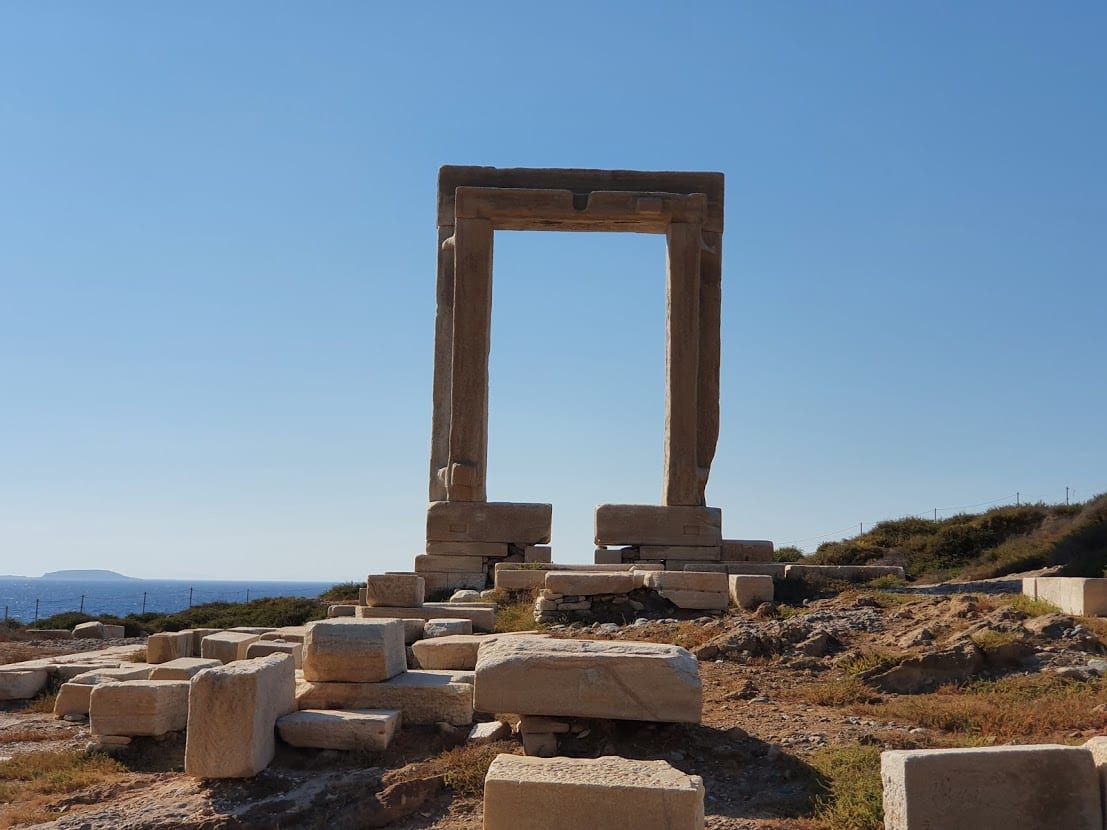 The Portara of Naxos along with some abaondoned stones from the temple
