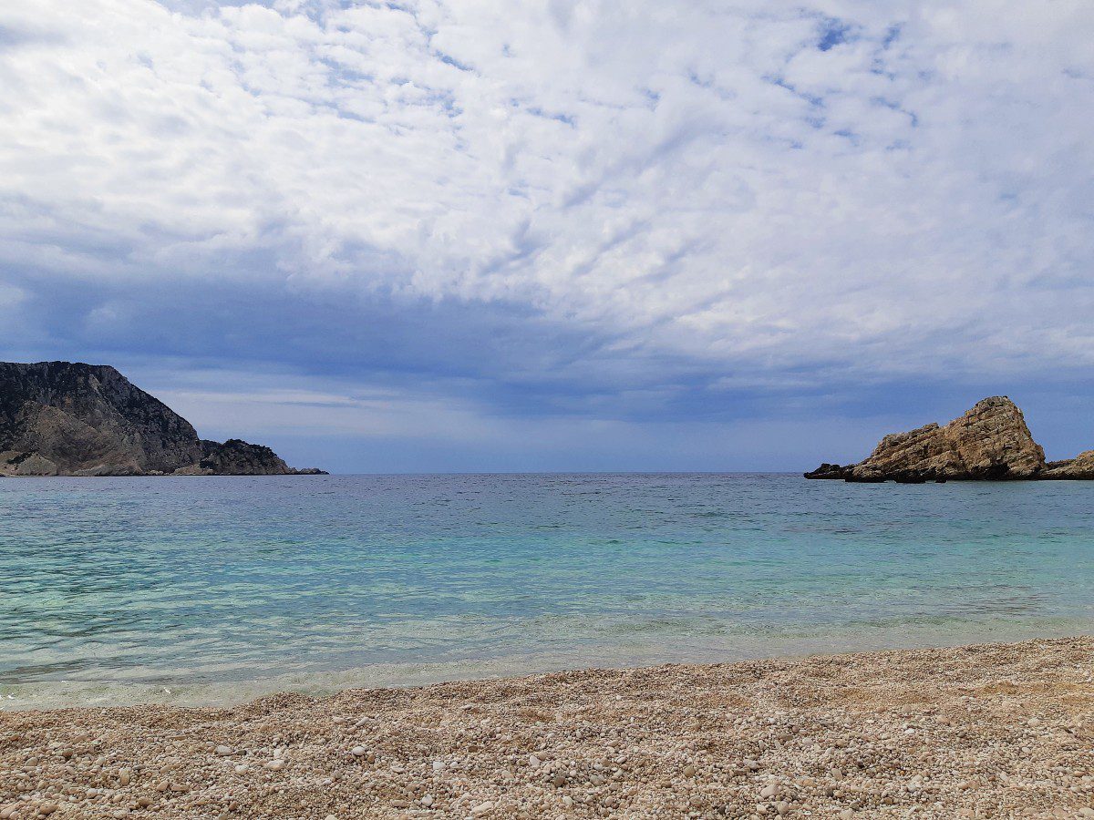 The pebbly Petani beach