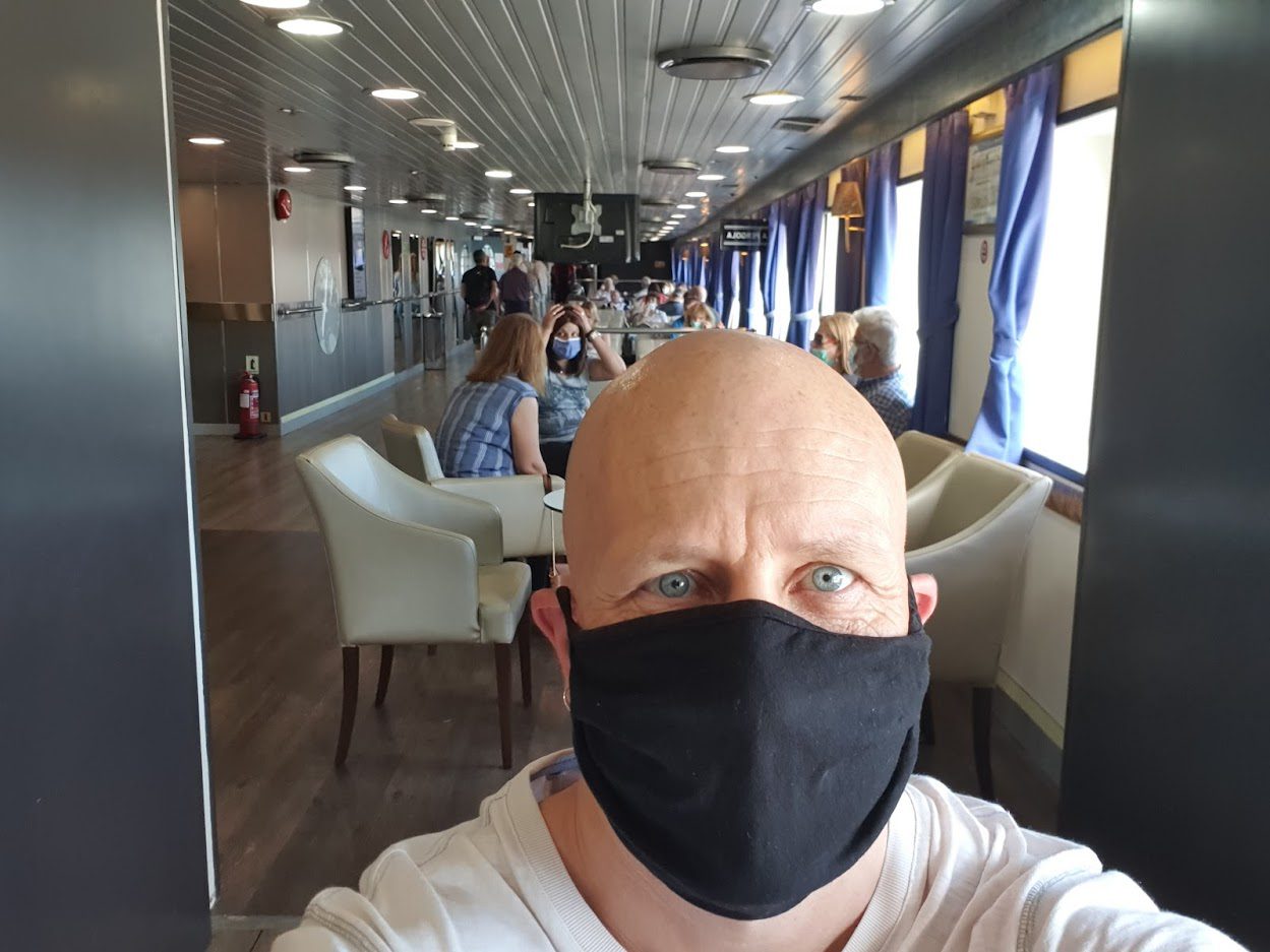 Dave wearing a mask on a greek ferry
