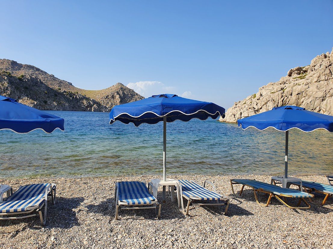 Sunbeds on the Symi beach of Saint Nicholas