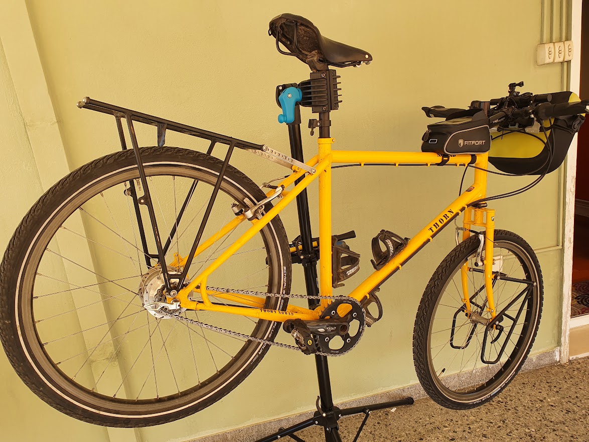 A bicycle clamped to a bike repair workstand by the seatpost