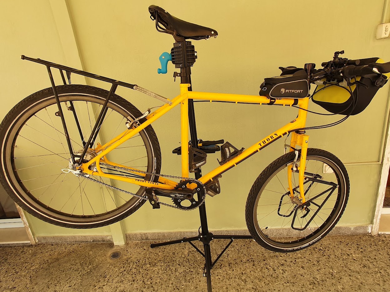 Thorn Nomad touring bicycle on a bike repair stand clamped using the seatpost