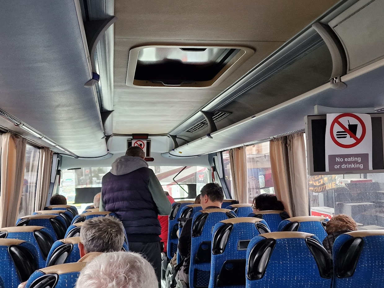 ticket seller on a santorini island bus